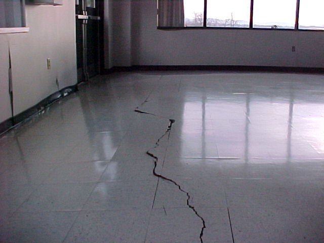 Estill County Middle School classroom flooring (left) had to be replaced and the Carhartt factory floor (right) was damaged by the pyrite oxidation and sulfate formation, which caused heaving in black shale foundation regolith in Estill County. 