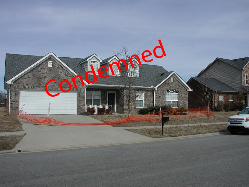 Condemned home in Berea, Ky., and expansive sulfate minerals in black shale.