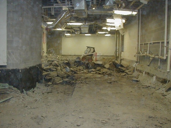 Estill County Middle School classroom flooring (left) had to be replaced and the Carhartt factory floor (right) was damaged by the pyrite oxidation and sulfate formation, which caused heaving in black shale foundation regolith in Estill County. 