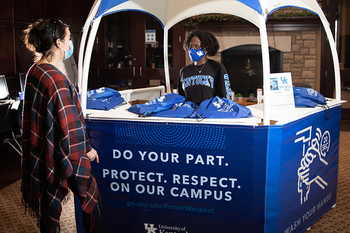 Student Getting Information from UK Wellness Booth